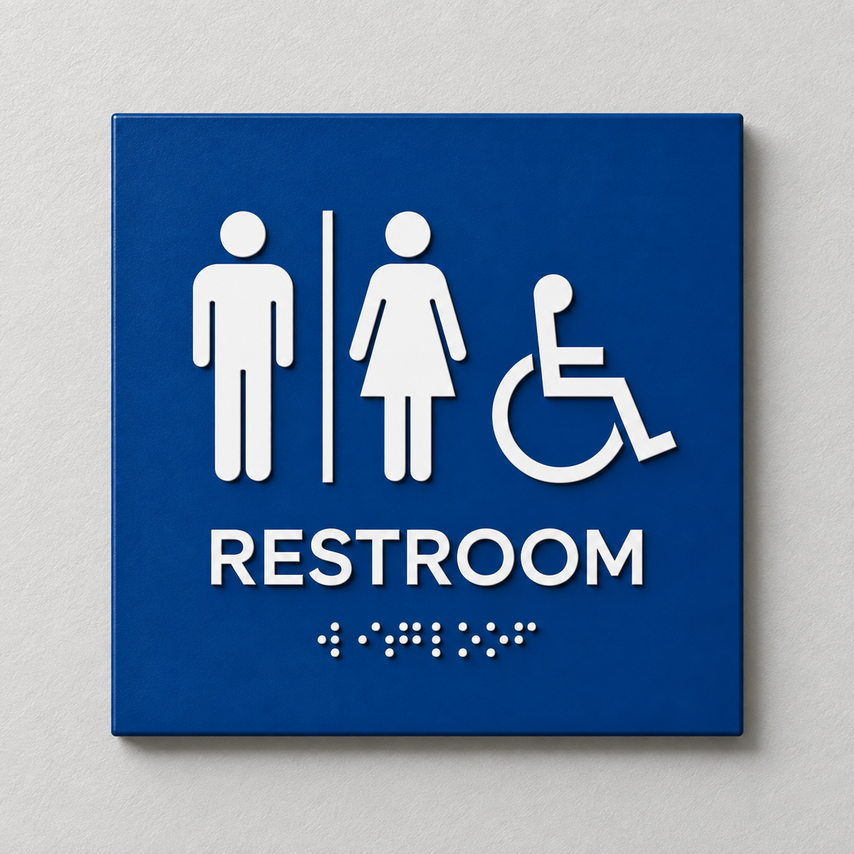 Blue ADA restroom sign with White raised male, female and accessibility symbols, tactile RESTROOM text and Braille.