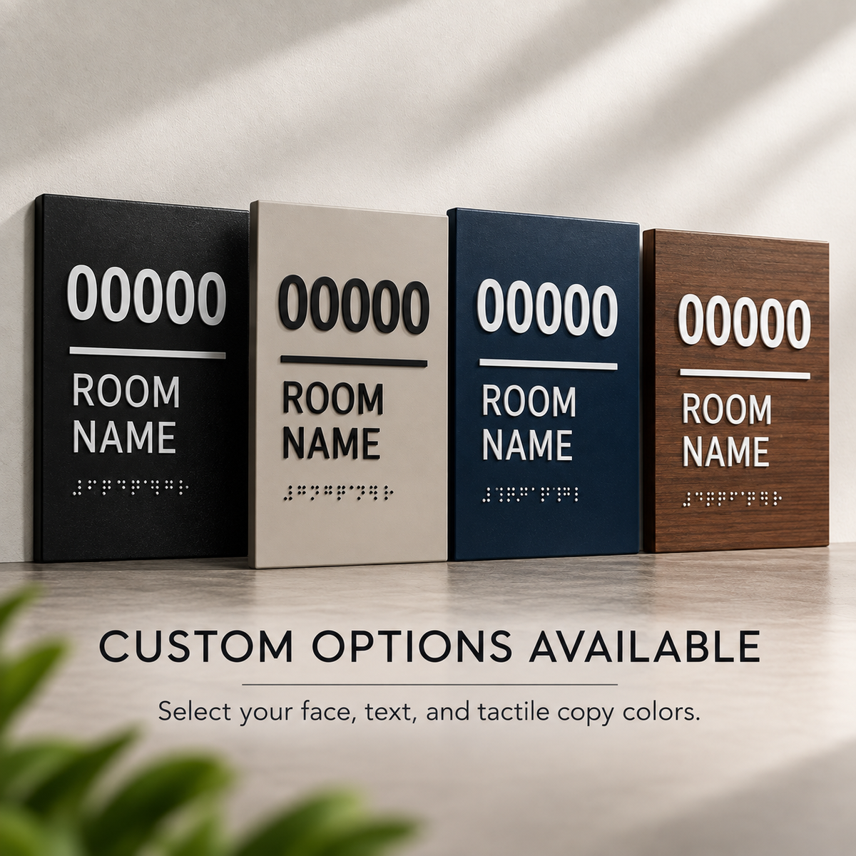 Custom ADA room identification signs shown in multiple face and tactile copy color combinations with raised room numbers, room name text and Braille.