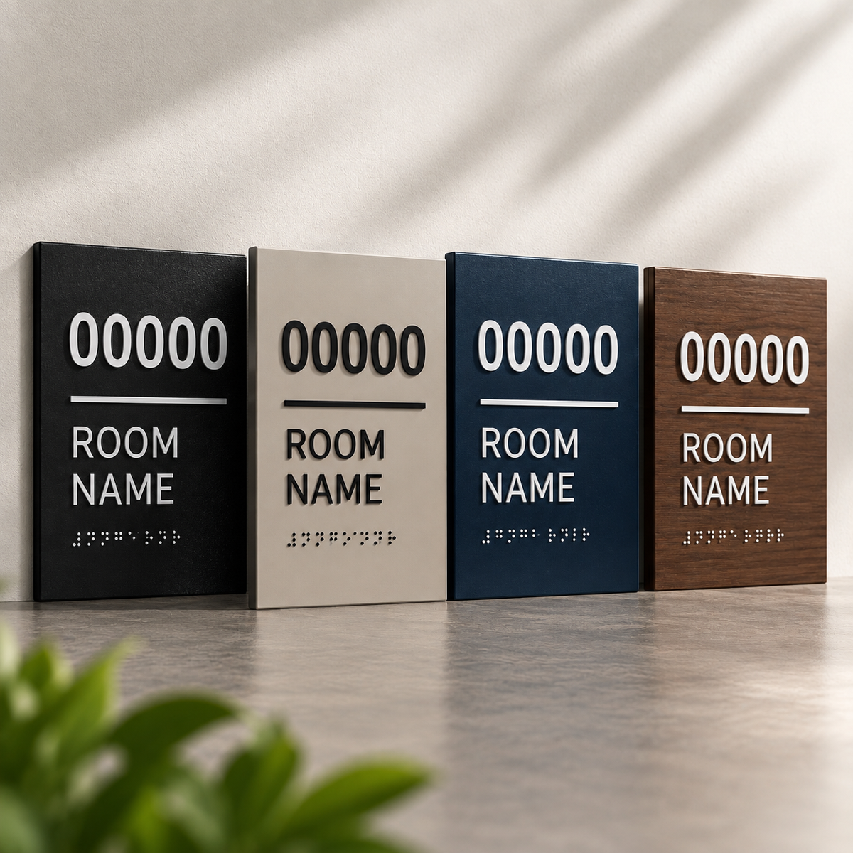 Standard ADA room identification signs in black, neutral, blue and wood-look finishes with raised tactile room numbers, room name text and Braille.